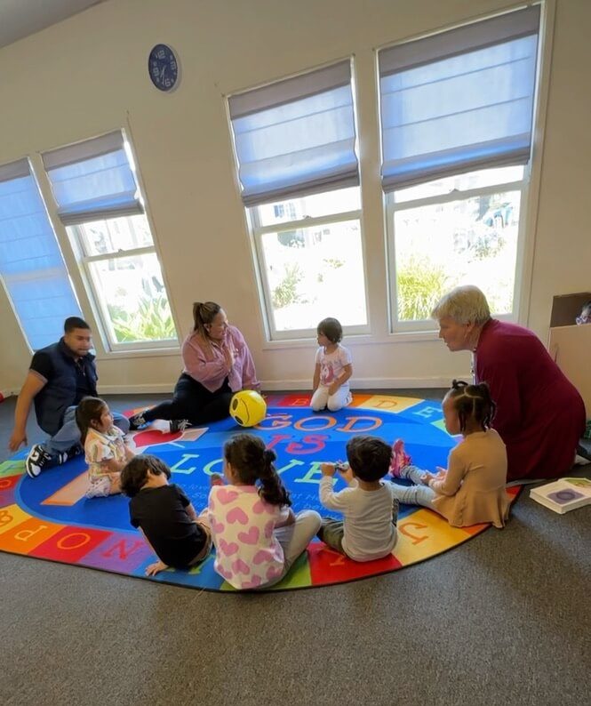 helpers small children on rug